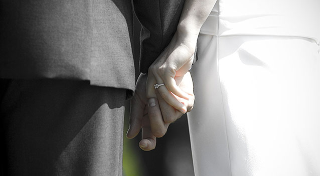 Wedding couple holding hands, Napier, New Zealand, Monday, June 11, 2011. Credit: SNPA / Bethelle McFedries