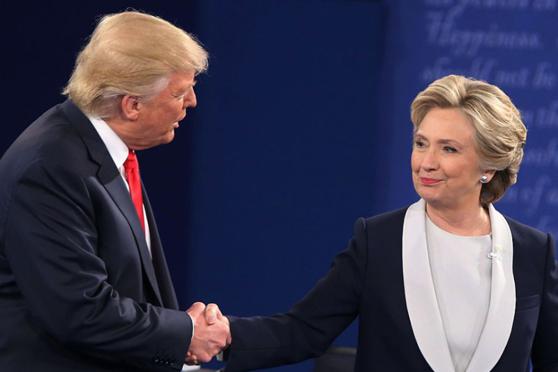 US Democratic presidential candidate Hillary Clinton and US Republican presidential candidate Donald Trump shake hands at the end of the second presidential debate at Washington University in St. Louis, Missouri, on October 9, 2016. / AFP / Tasos Katopodis (Photo credit should read TASOS KATOPODIS/AFP/Getty Images)