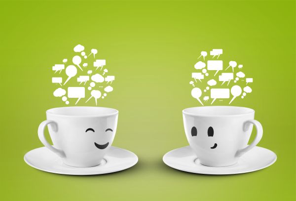 two cups smileys with speech bubbles