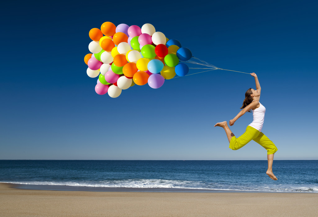 happy-woman-jumping-on-the-beach-1024x699